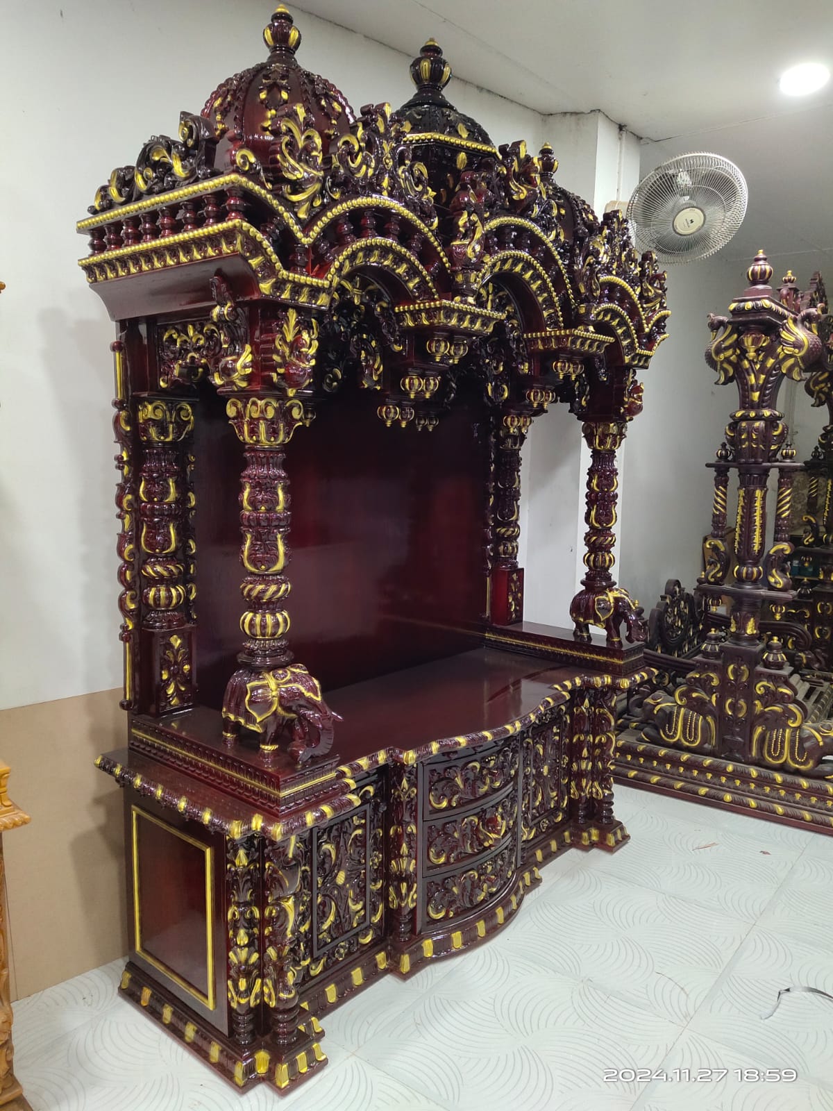 Dome finials carved and gilded by hand.
