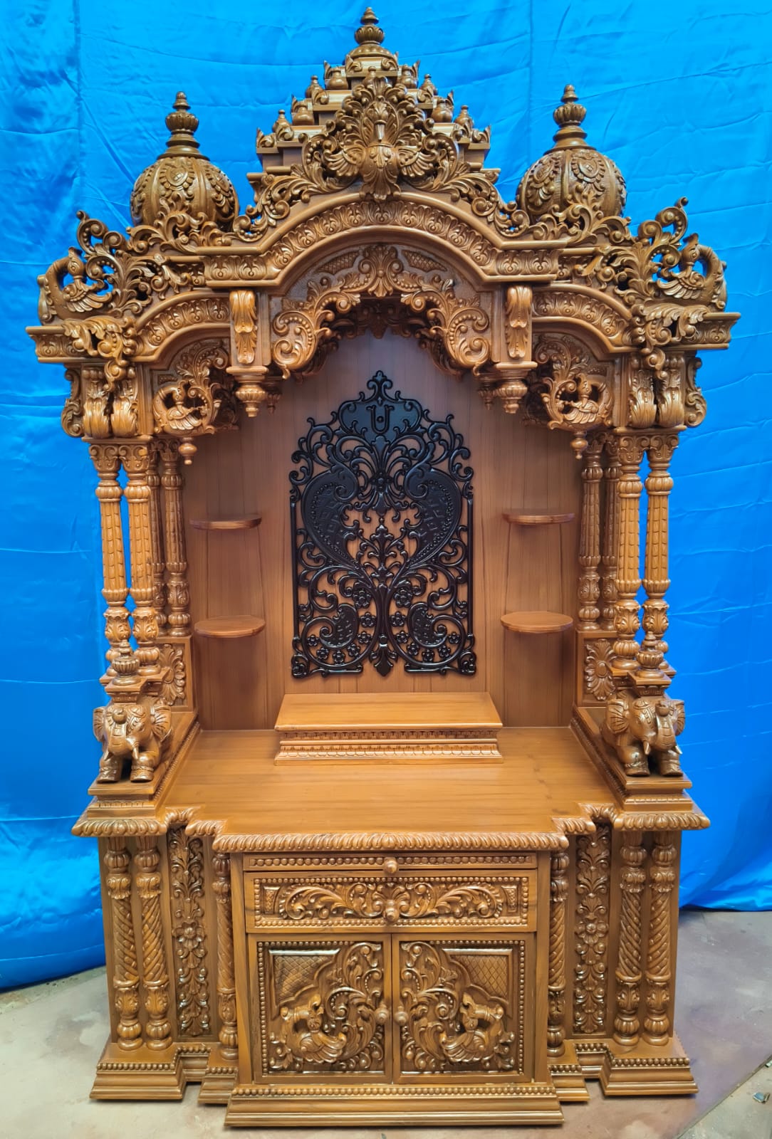 The Ghar Mandir, carved in the traditional home-sanctuary form.